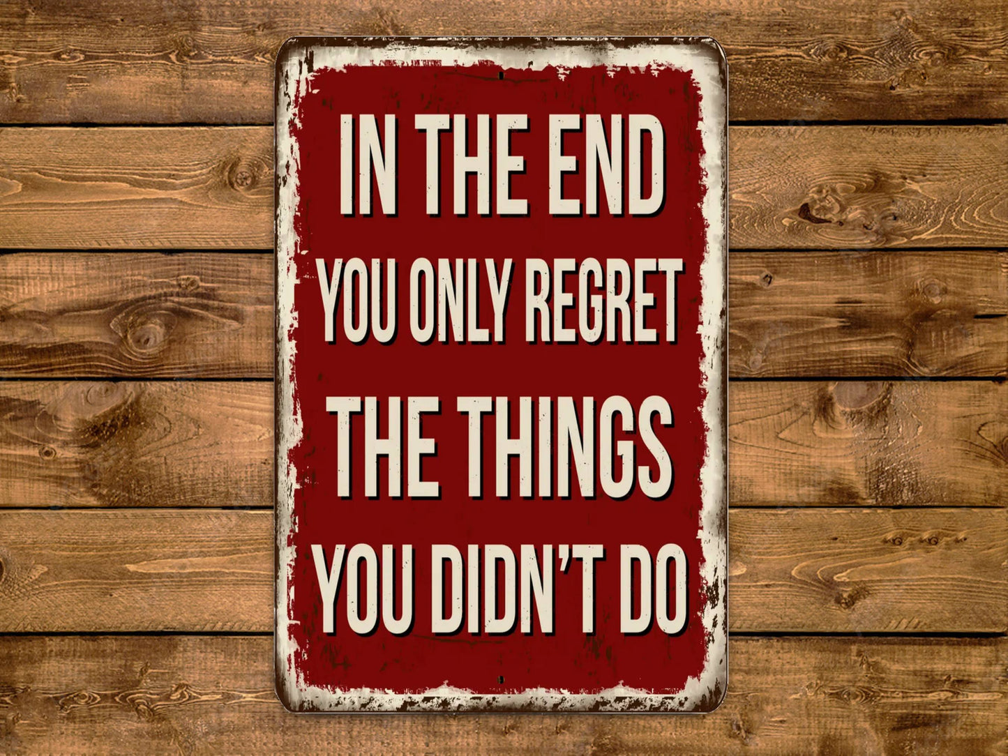 a red sign that says in the end you only regret the things you didn '