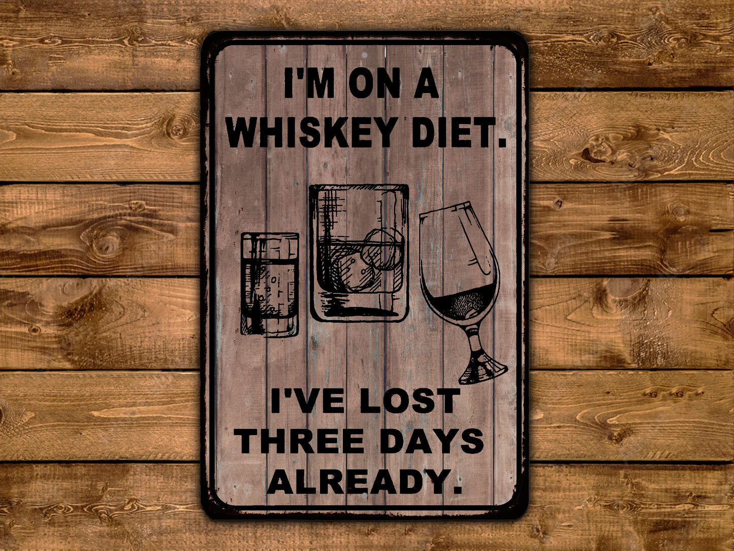 a wooden sign that says i'm on a whiskey diet i've lost