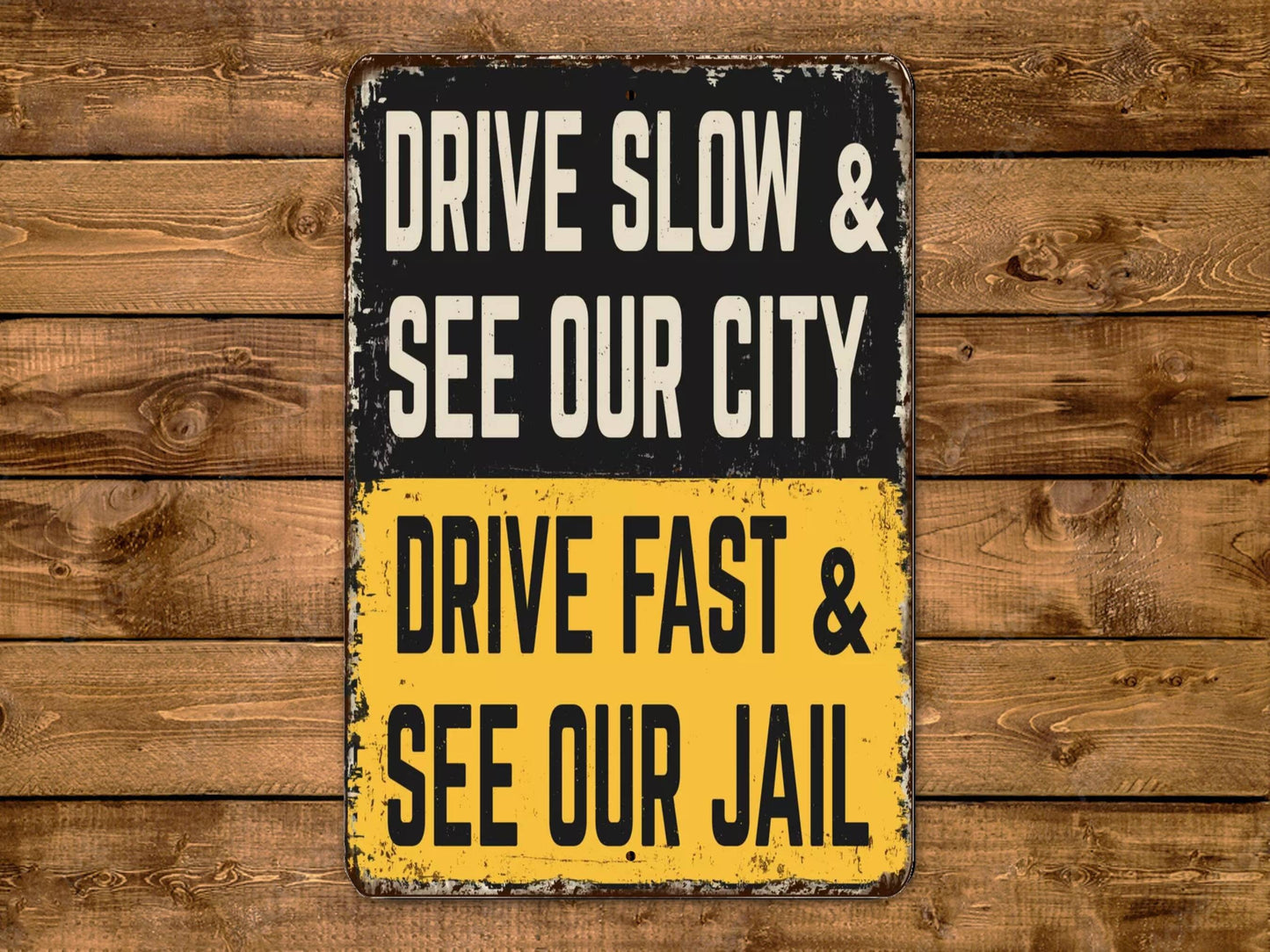 a sign that says drive slow and see our city drive fast and see our jail
