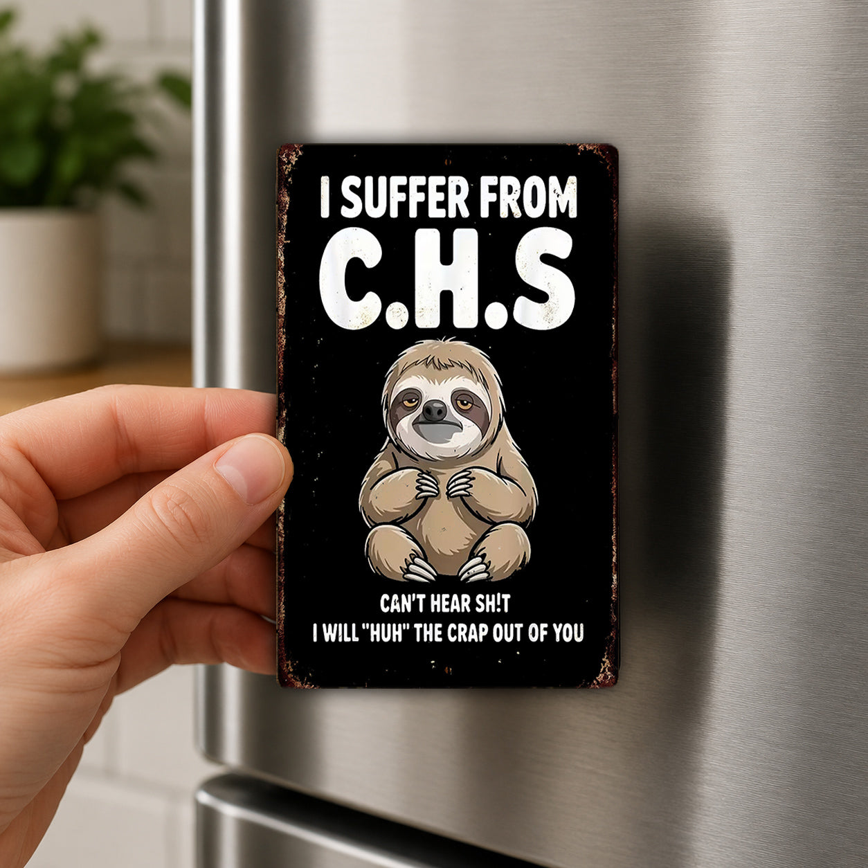 A person is holding a sign with a sloth illustration and text that reads "I Suffer From C.H.S. CAN'T HEAR SHIT I WILL 'uh' THE CRAP OUT OF YOU".