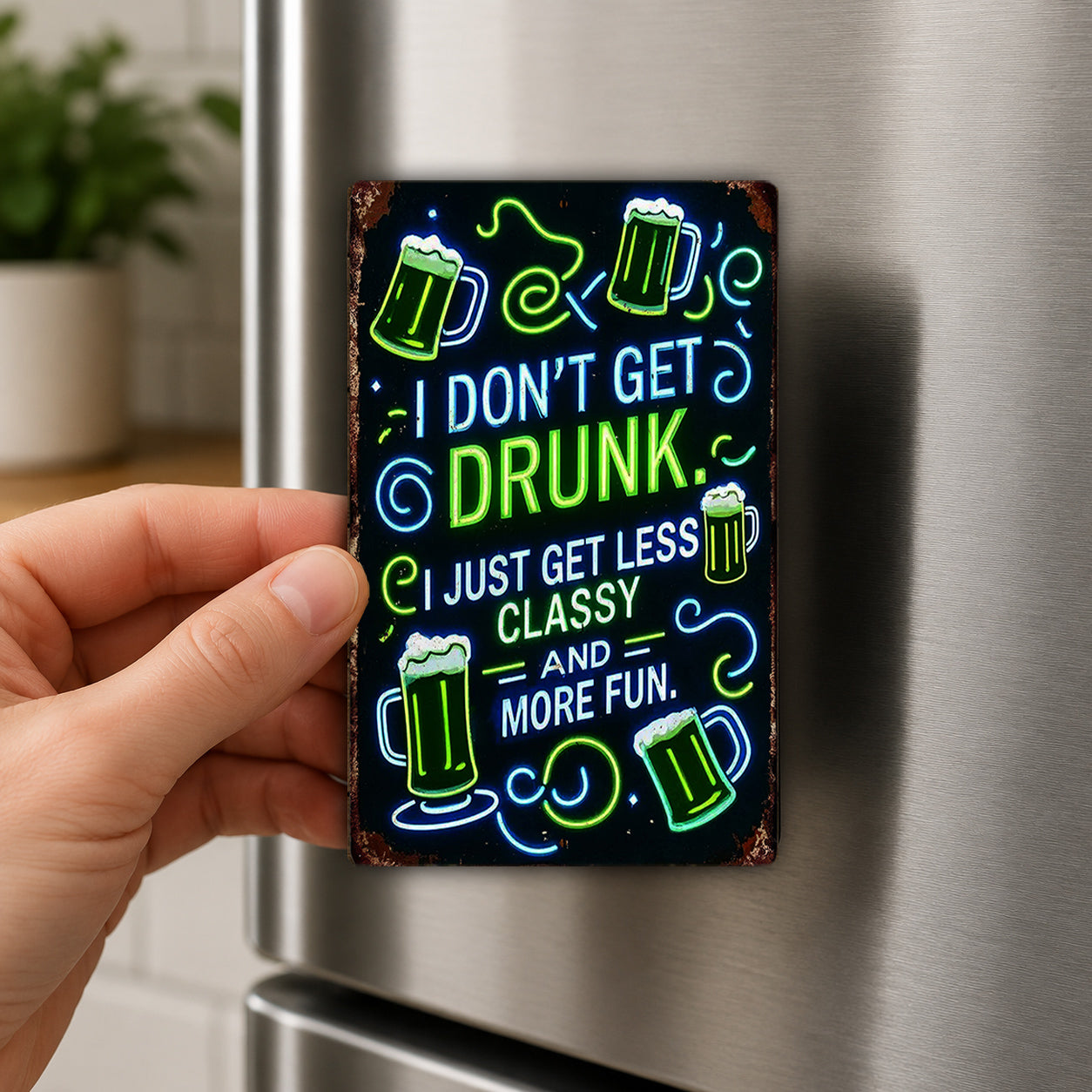 A hand is holding a metal magnet with a humorous text and beer mug design on it.