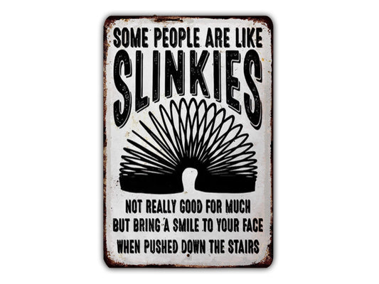 The image is a sign with the text "Some people are like SLINKIES" and a graphic of a slinky toy.