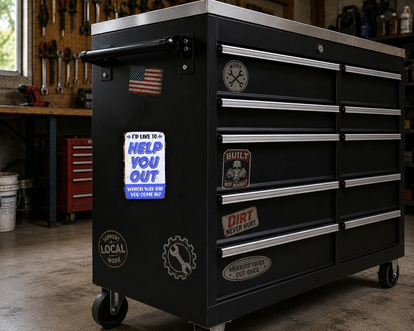 A black workbench with various stickers and magnets on it, located in a workshop setting.