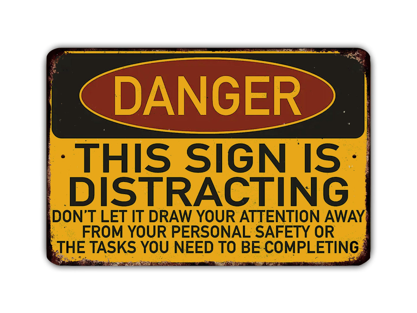 a sign with the word "DANGER" in large letters, indicating a warning or hazard. The sign also contains a message that says "THIS SIGN IS DISTRACTING" and advises not to draw attention away from personal safety or the tasks that need to be completed.
