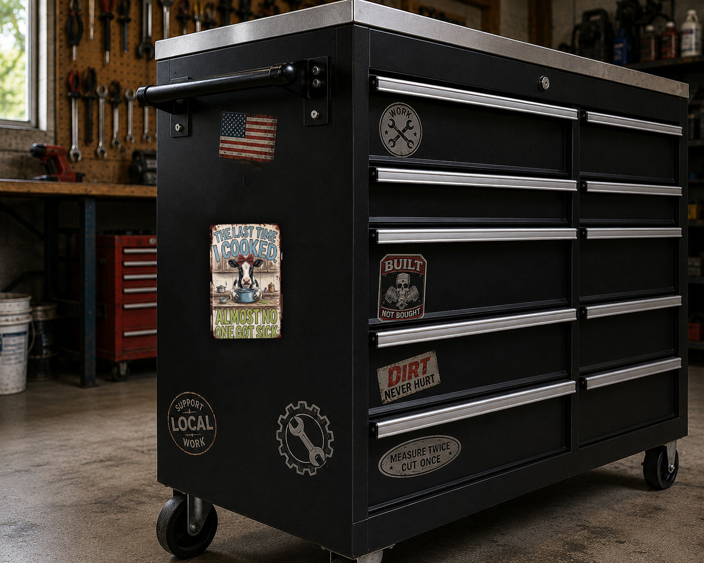 A black workbench with various stickers and labels on it, located in a workshop setting.