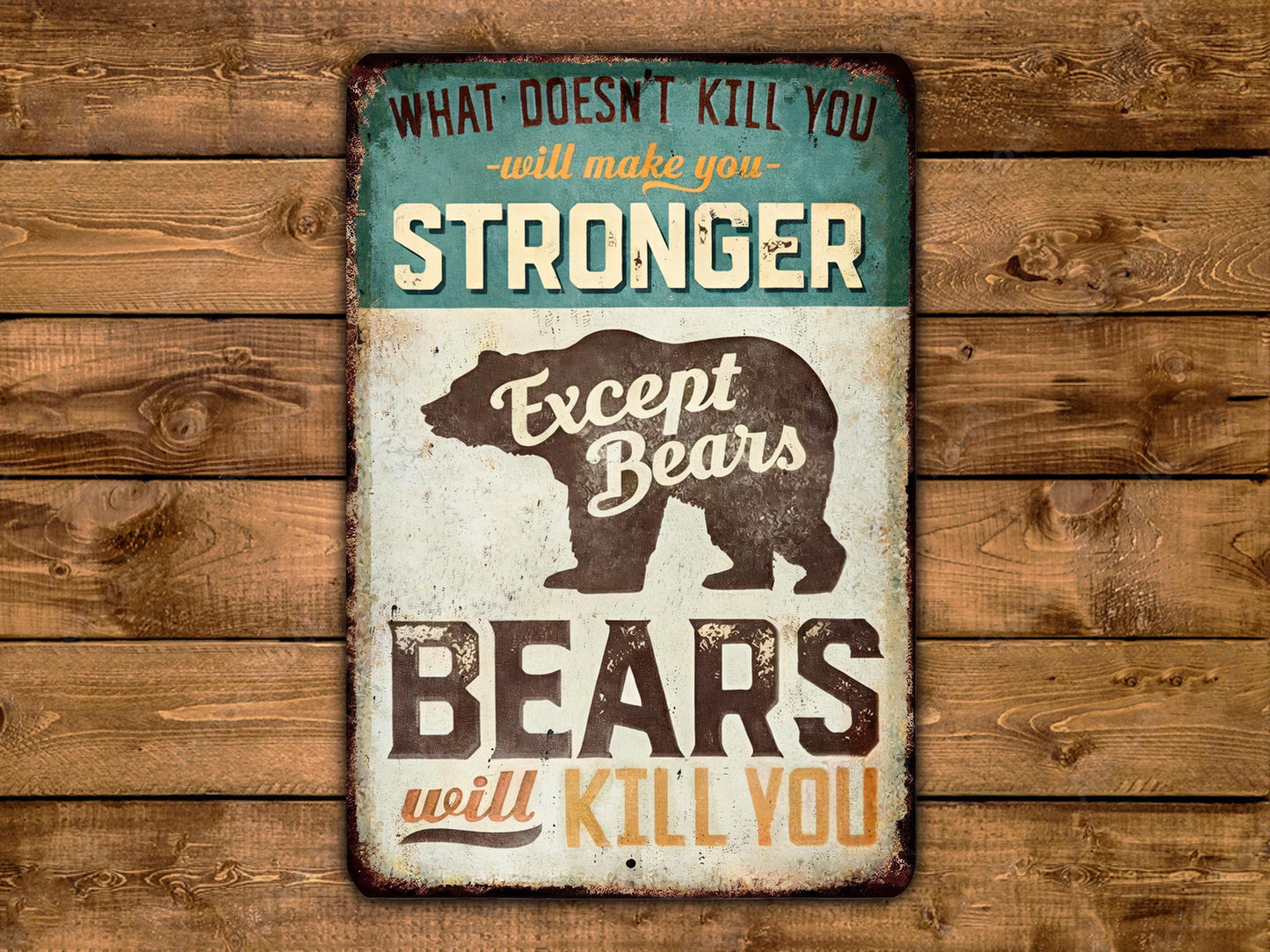 a vintage-style sign with the text "What doesn't kill you will make you stronger Except Bears will kill you" displayed prominently.