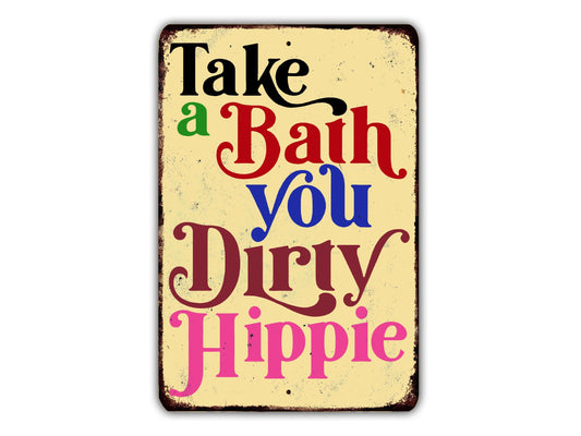 a sign with the text "Take a Bath You Dirty Hippie" in a vintage style.