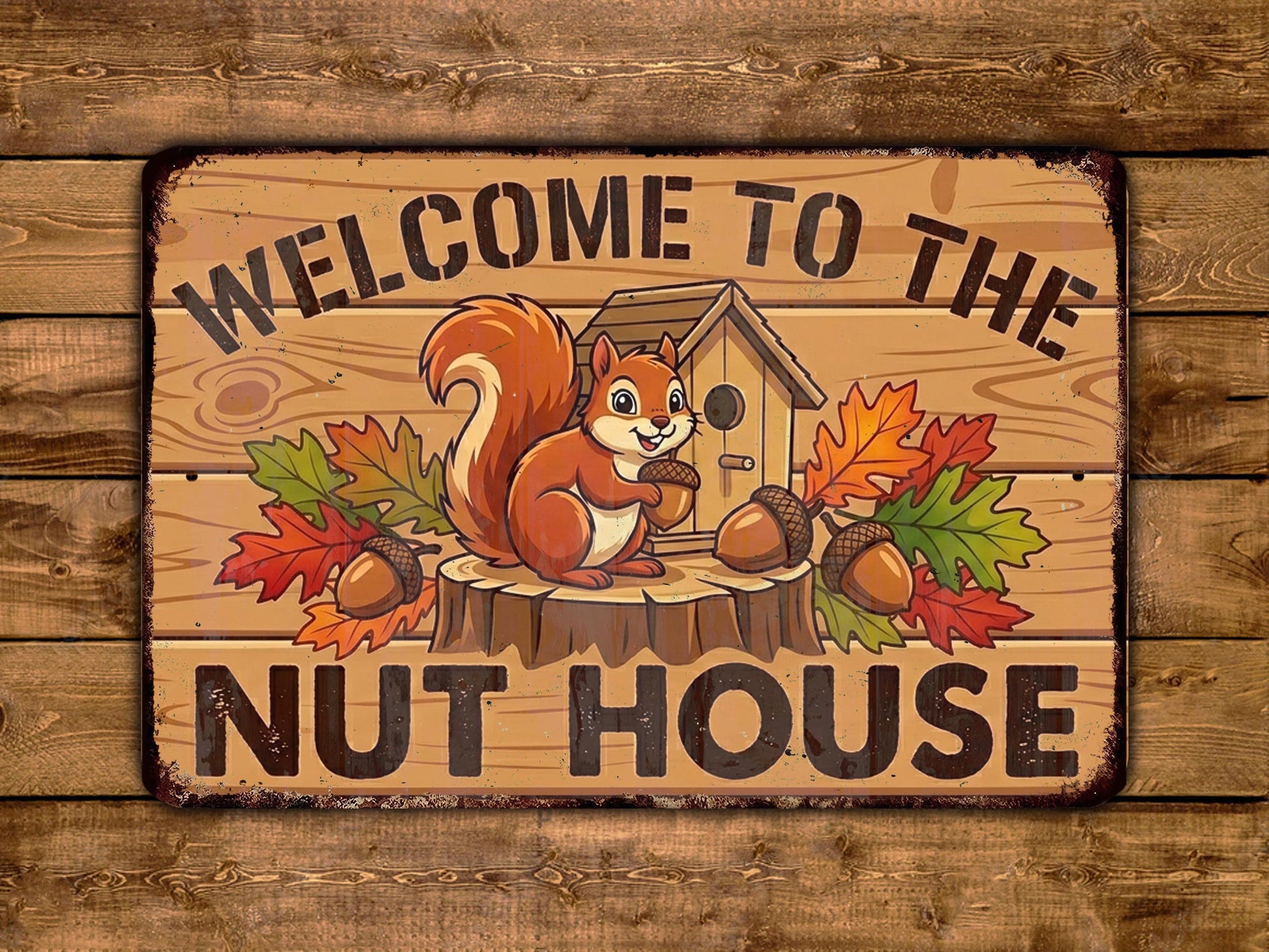 A wooden sign with a cartoon squirrel and autumn leaves, along with the text "WELCOME TO THE NUT HOUSE".