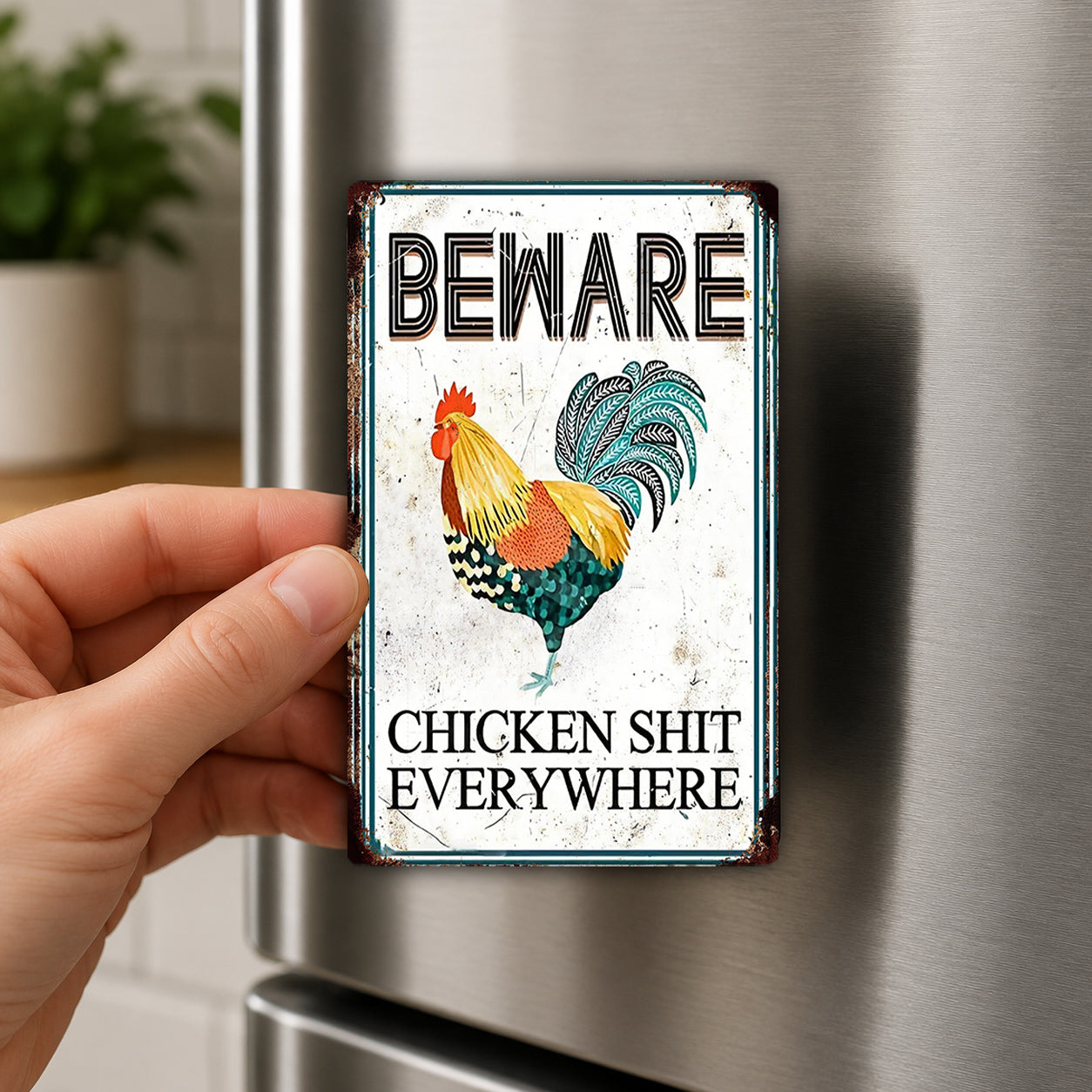 a person holding a metal sign with a rooster and the text "BEWARE CHICKEN SHIT EVERYWHERE" on it.