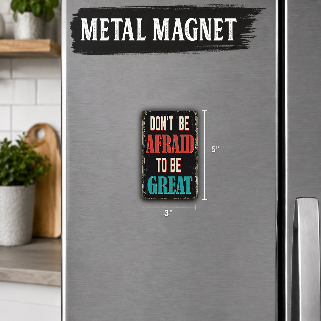 a small, colorful sign with the text "Don't be afraid to be great" on a refrigerator.
