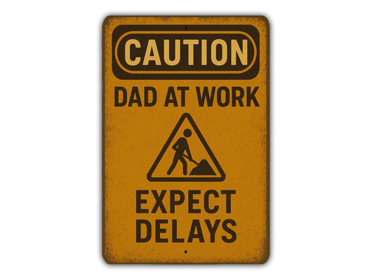 a yellow caution sign that says, caution dad at work expect delayss