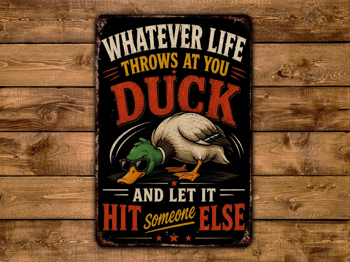 a sign with a humorous message about ducks and life.