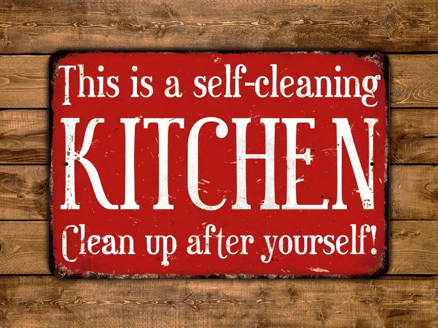The image is a red sign with white text that reads "This is a self-cleaning KITCHEN Clean up after yourself!"