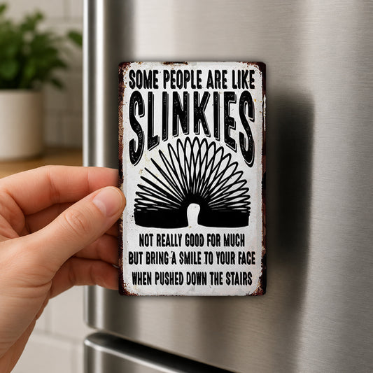 A person is holding a metal sign with a humorous message about slinking people.