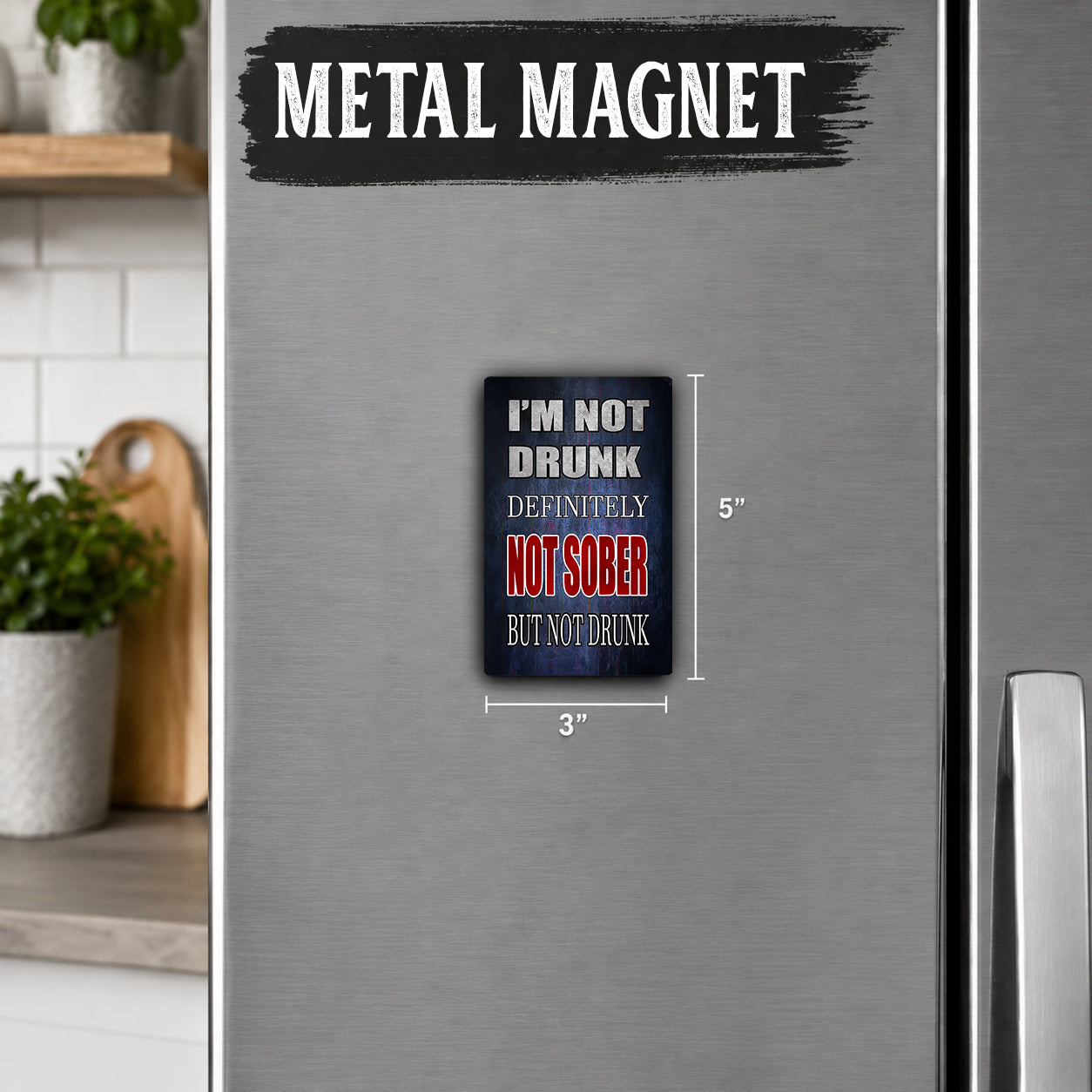 a refrigerator with a metal magnet on it. The magnet has a humorous message that reads "I'm not drunk, definitely not sober, but not drunk".