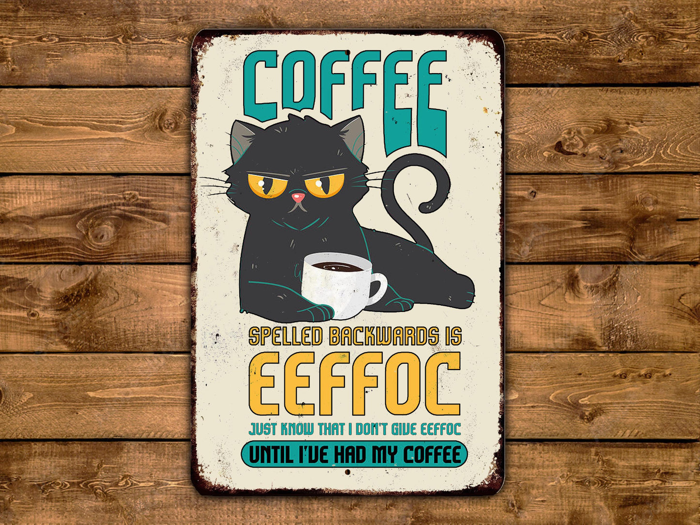 The image is a humorous sign featuring a black cat with a coffee cup, accompanied by the text "COFFEE SPELLED BACKWARDS IS EEFOC" and "Just know that I don't give effee".