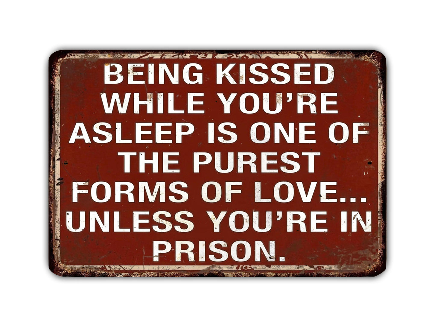 a sign with a message about love and relationships, stating that being kissed while asleep is one of the purest forms of love, unless the person is in prison.
