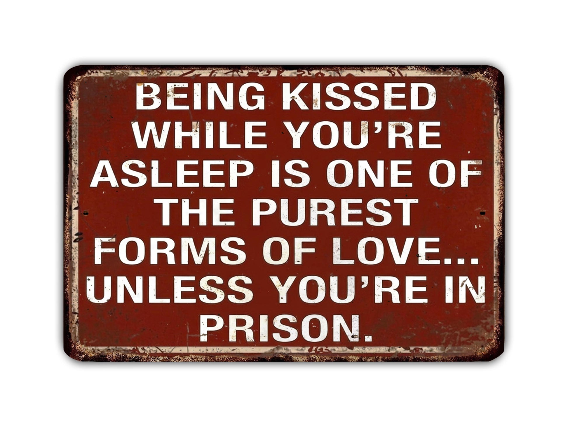 a sign with a message about love and relationships, stating that being kissed while asleep is one of the purest forms of love, unless the person is in prison.