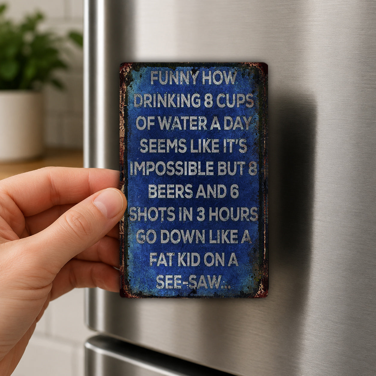 a person's hand holding a metal sign with humorous text on it, which appears to be a humorous quote or meme.