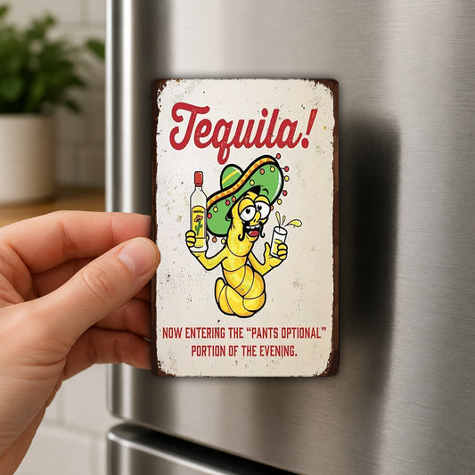 A person's hand is holding a small metal sign with a cartoon character and text on it.