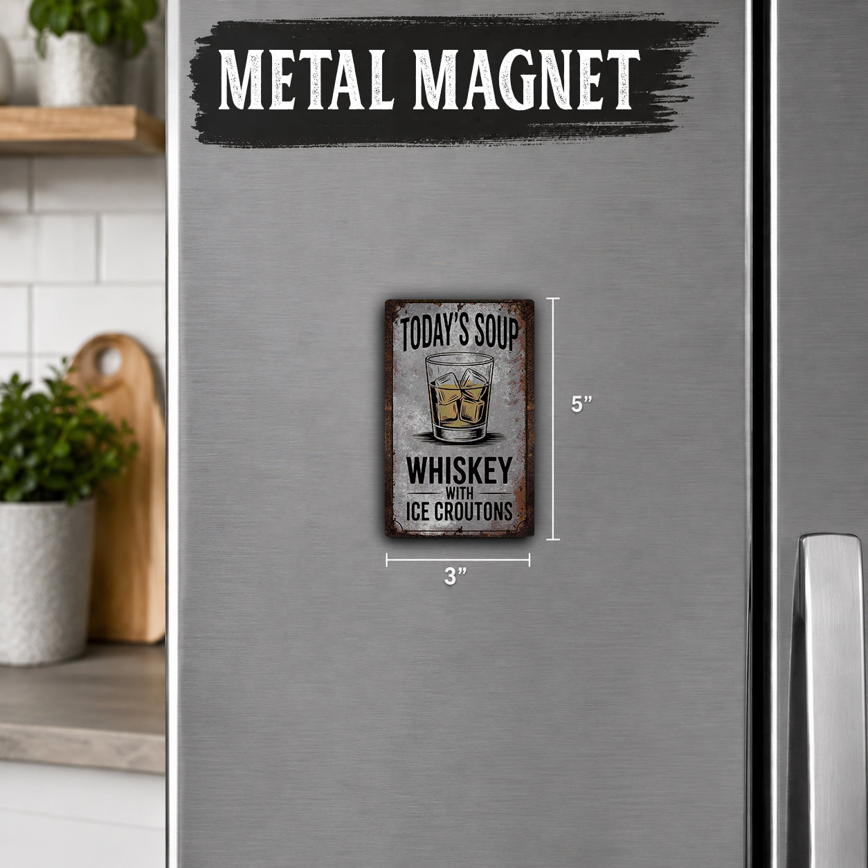 a refrigerator with a small metal magnet on it. The magnet has a picture of a glass of whiskey and the text "Today's Soup with Ice Crostons".