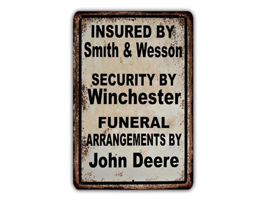 a sign that reads "Insured by Smith & Wesson Security by Winchester Funeral Arrangements by John Deere".