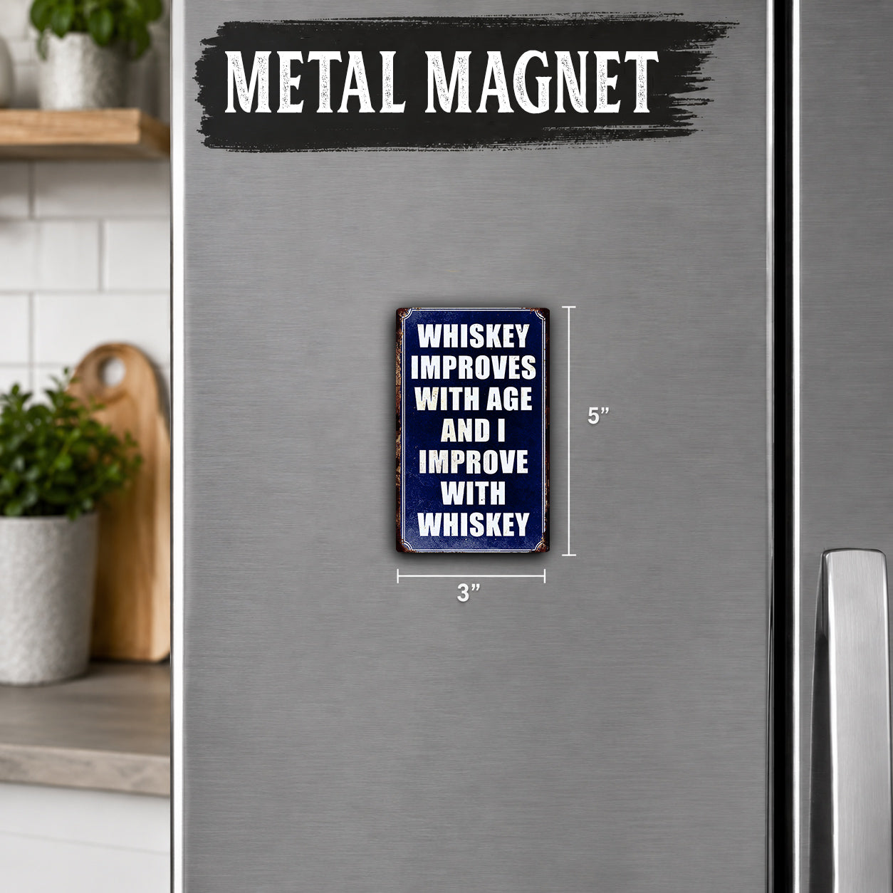 a refrigerator with a metal magnet on it. The magnet has a message that reads "Whiskey improves with age and improves with whiskey".