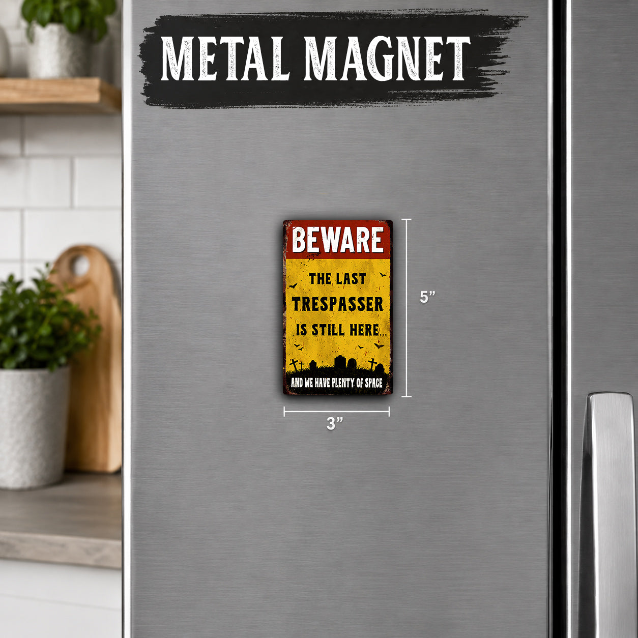 a small, vintage-style metal magnet with a warning message on it.