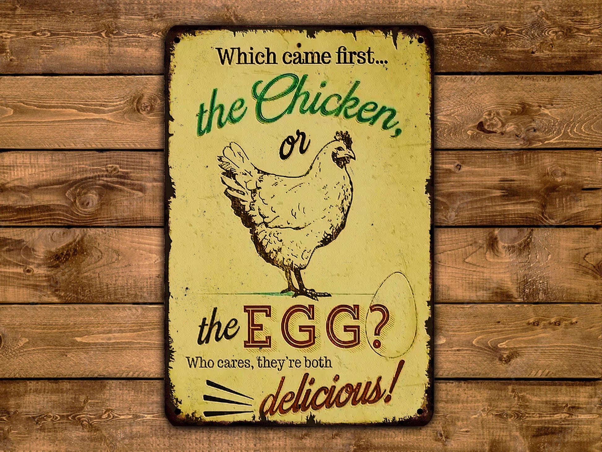 a sign with a chicken and an egg, asking which came first: the chicken or the egg.