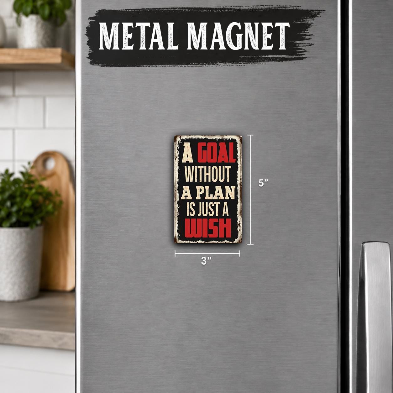 a small metal magnet with the text "A GOAL without A PLAN is just a WISH" on it.