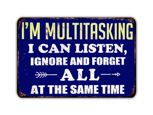 a sign that says i'm multitasking i can listen, ignore and