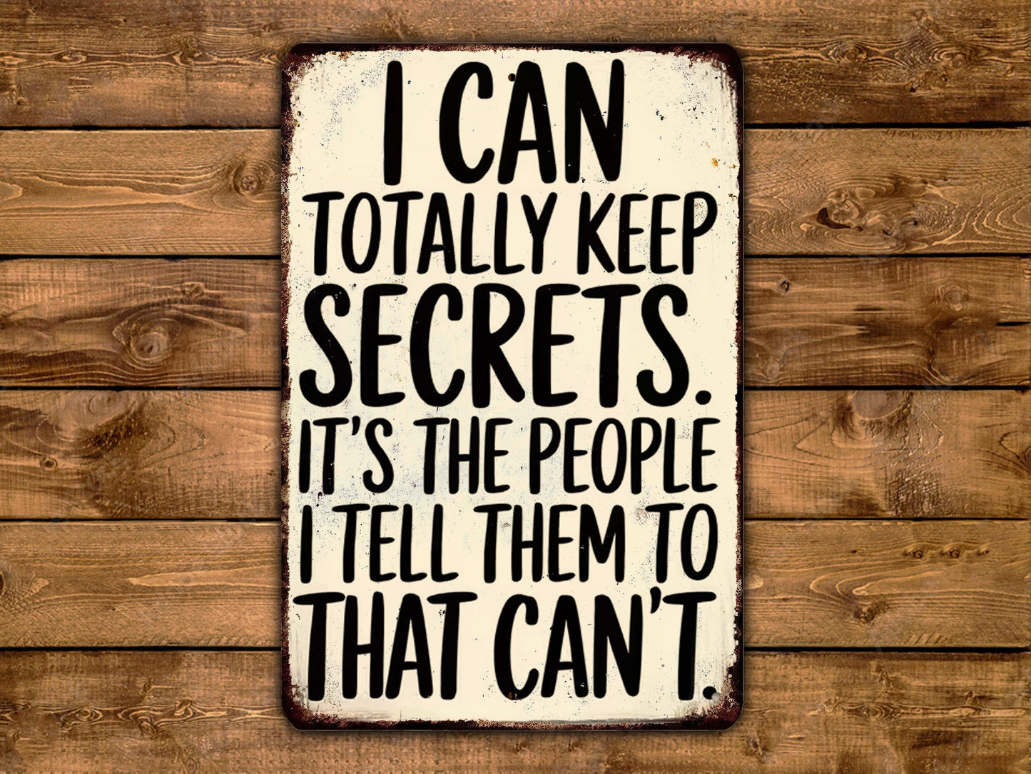 a sign with the text "I can totally keep secrets. It's the people I tell them to that can't" written on it.