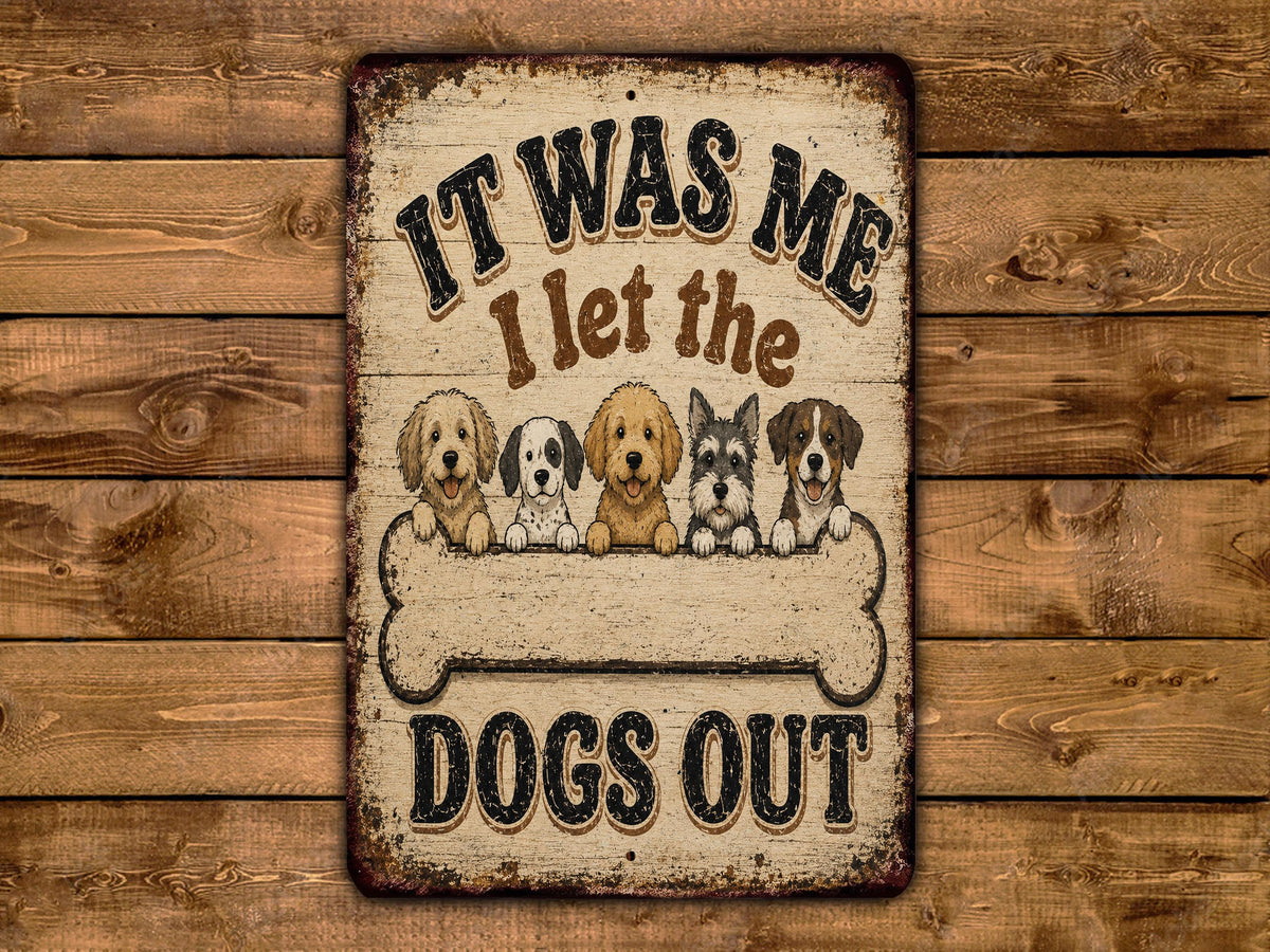 A metal sign with a wooden background, featuring a group of cartoon dogs sitting together and the text "IT WAS ME I LET THE DOGS OUT".