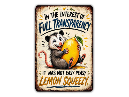 a cartoon opossum holding a lemon and making a face, accompanied by text that reads "In the interest of full transparency, it was not easy peasy lemon squeezy."