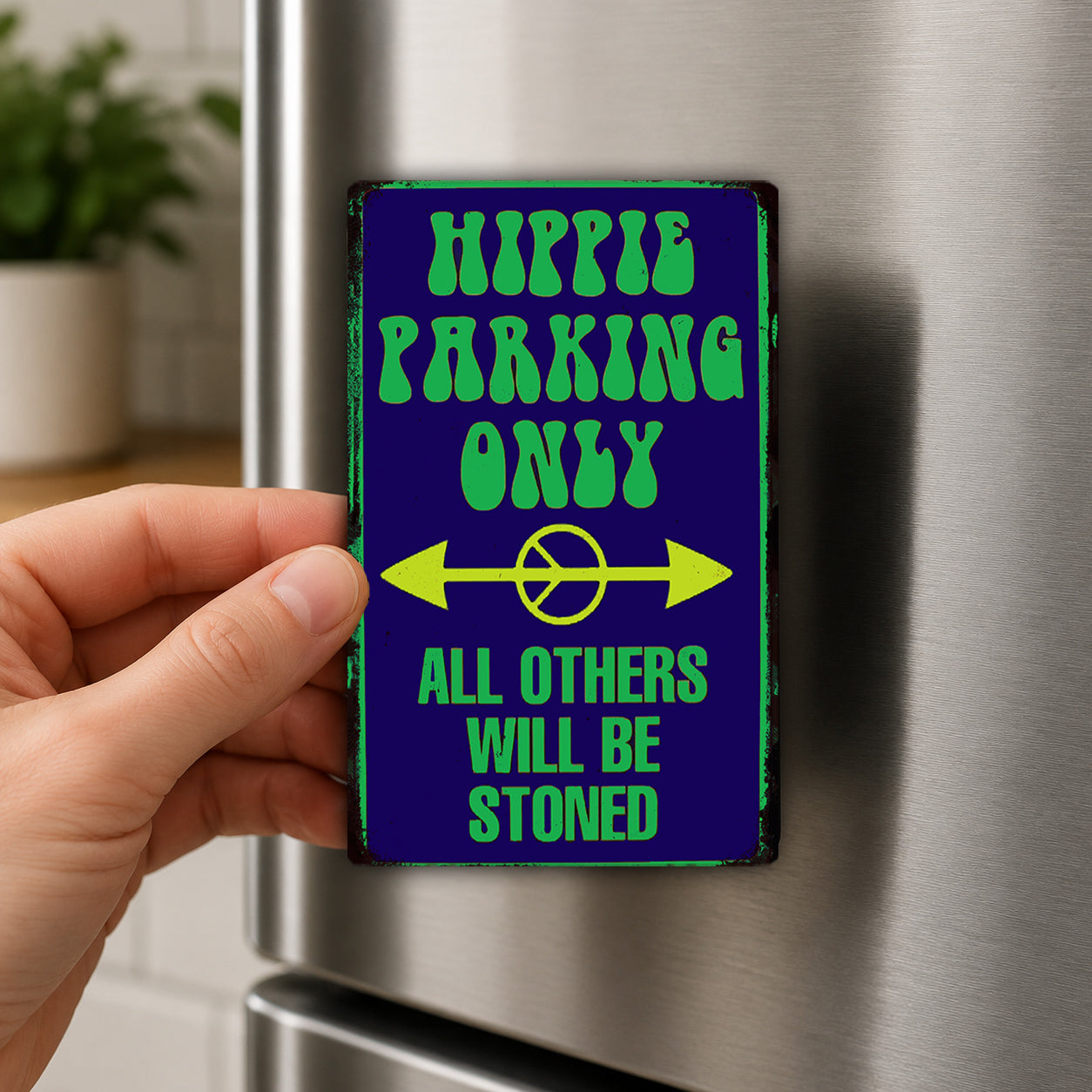 A hand is holding a sign that says "Hippie Parking Only" with a peace symbol and the text "All others will bestoned".