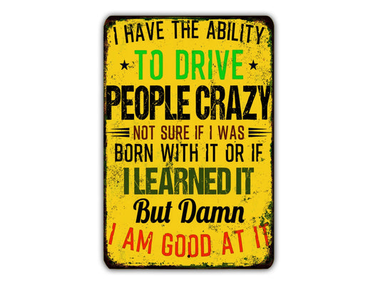 a humorous and exaggerated statement about the ability to drive crazy people, with the text "I HAVE THE ABILITY TO DRIVE PEOPLE CRAZY NOT SURE IF I WAS BORN WITH IT OR IF I LEARNED IT But Damn I AM GOD AT IT" displayed in a distressed and worn appearance.