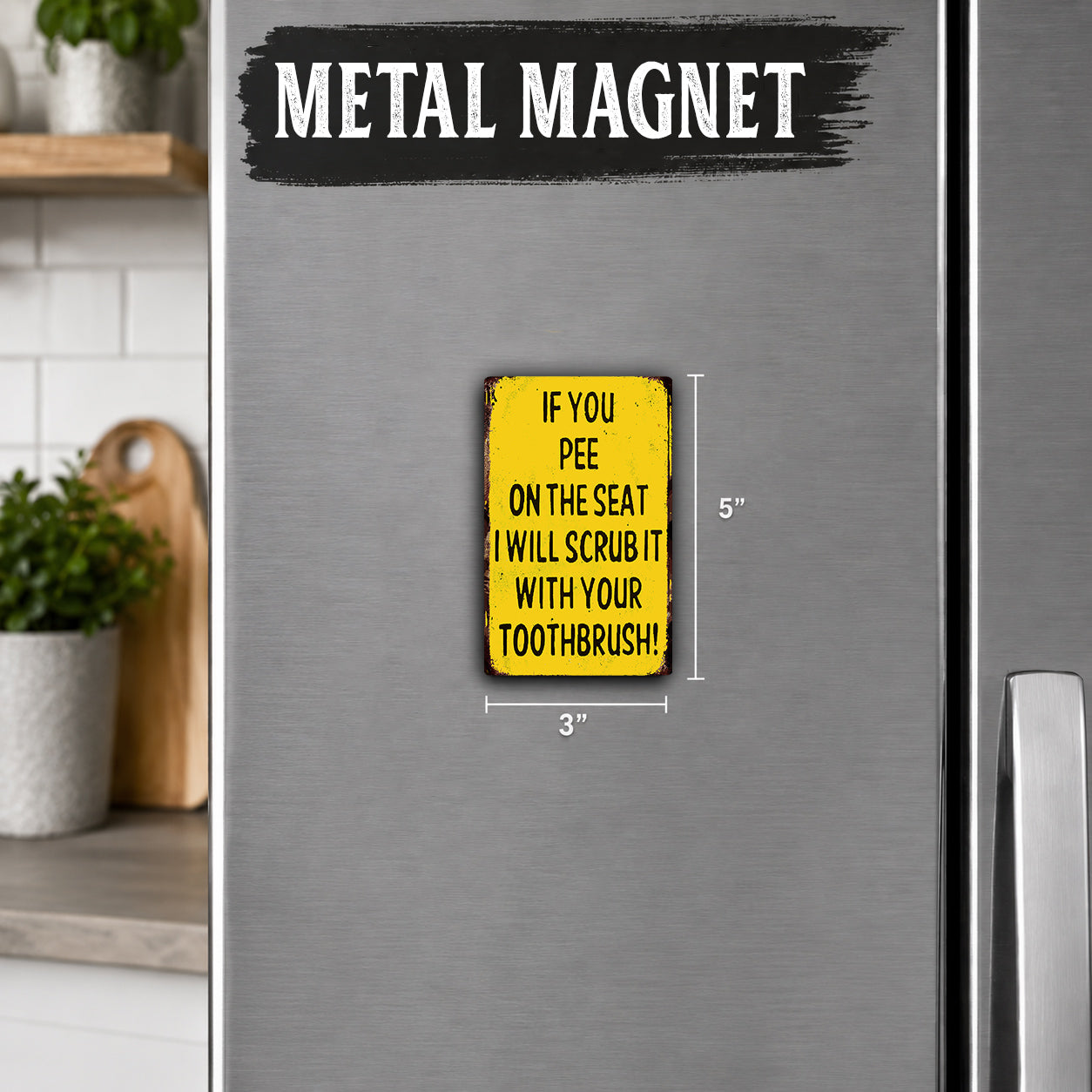 a small yellow sign on a silver refrigerator that reads "If you pee on the seat, I will scrub it with your toothbrush!".