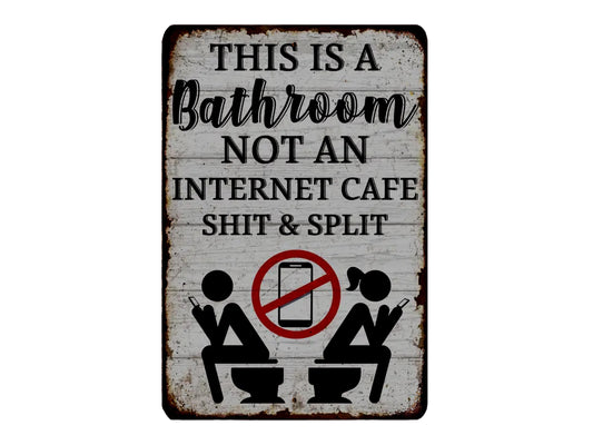 a sign that reads "THIS IS A Bathroom NOT AN INTERNET CAFE SHIT & SPLIT" with a prohibition symbol over a depiction of two people using cell phones in a bathroom.