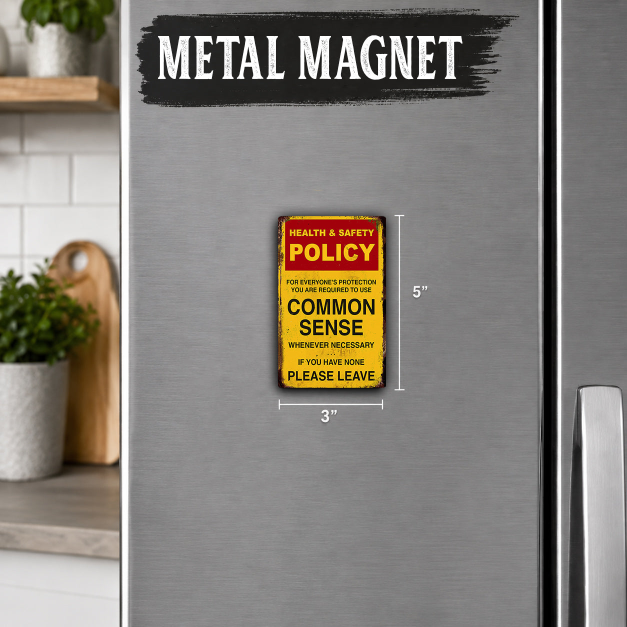 a metal refrigerator with a metal magnet on it that says "Health & Safety Policy Common Sense".