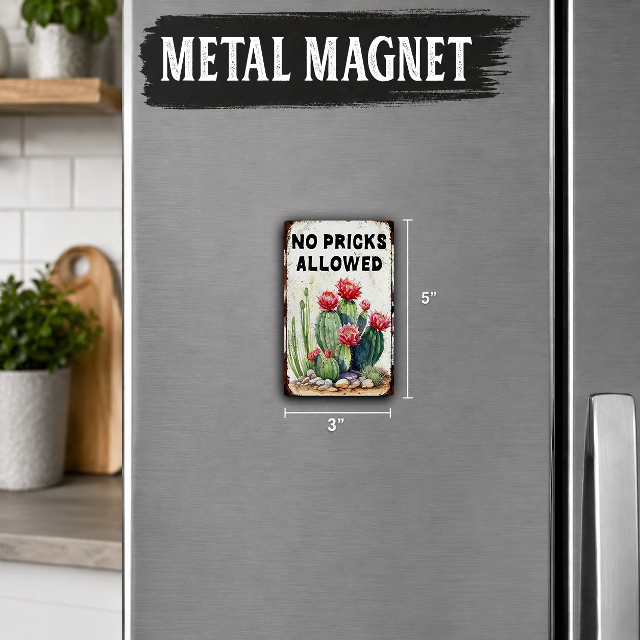 a metallic refrigerator with a small metal sign that reads "No Pricks Allowed" and measures 3 inches in height.