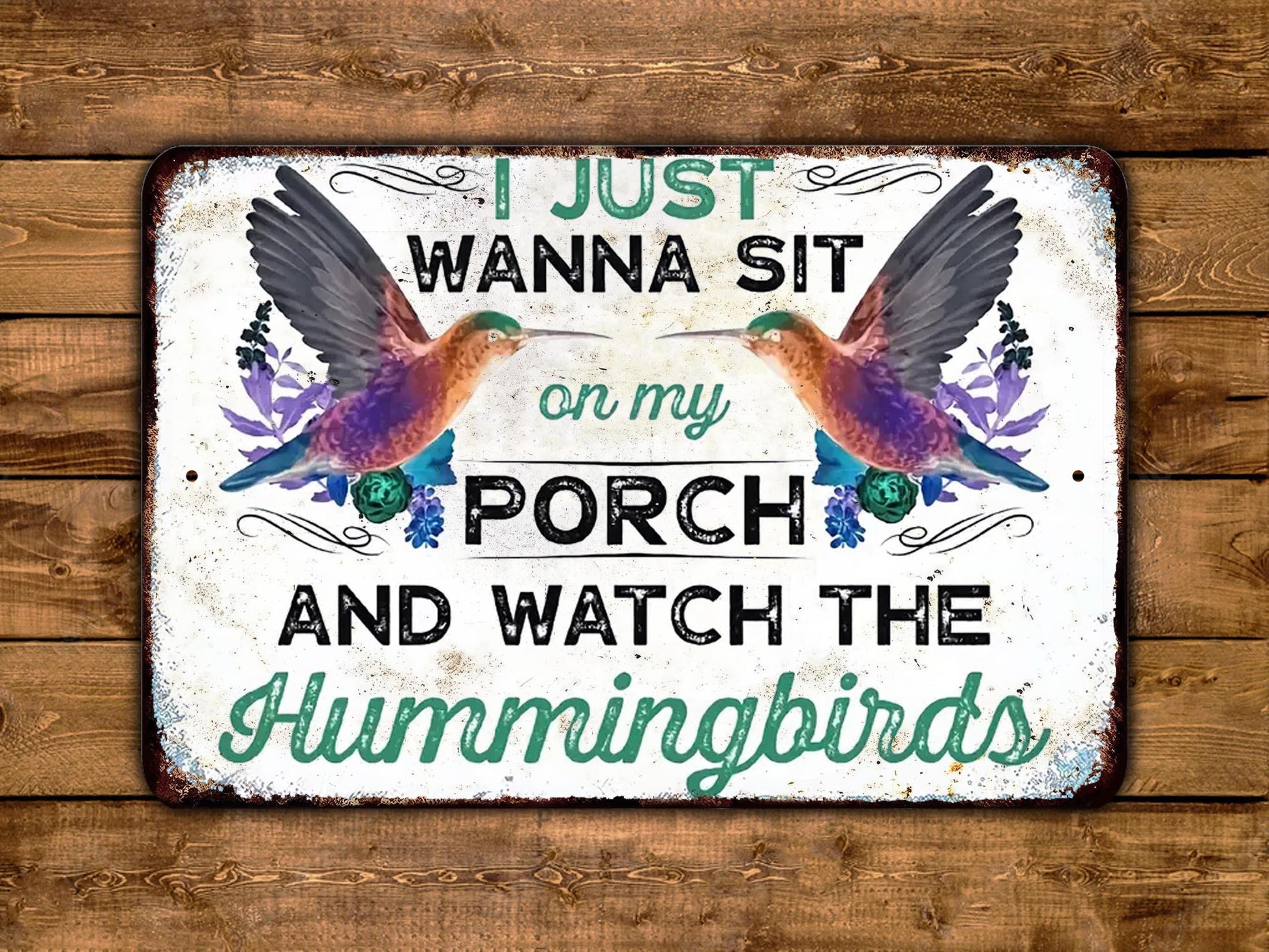 a sign that says i just wanna sit on my porch and watch the hummingbirds