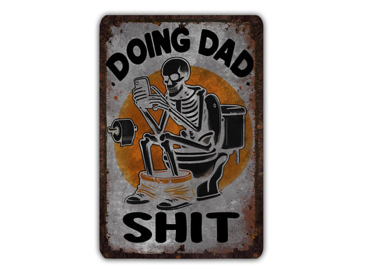 a skeleton sitting on a toilet and holding a phone, with the text "DOING DAD SHIT" above and below the skeleton.