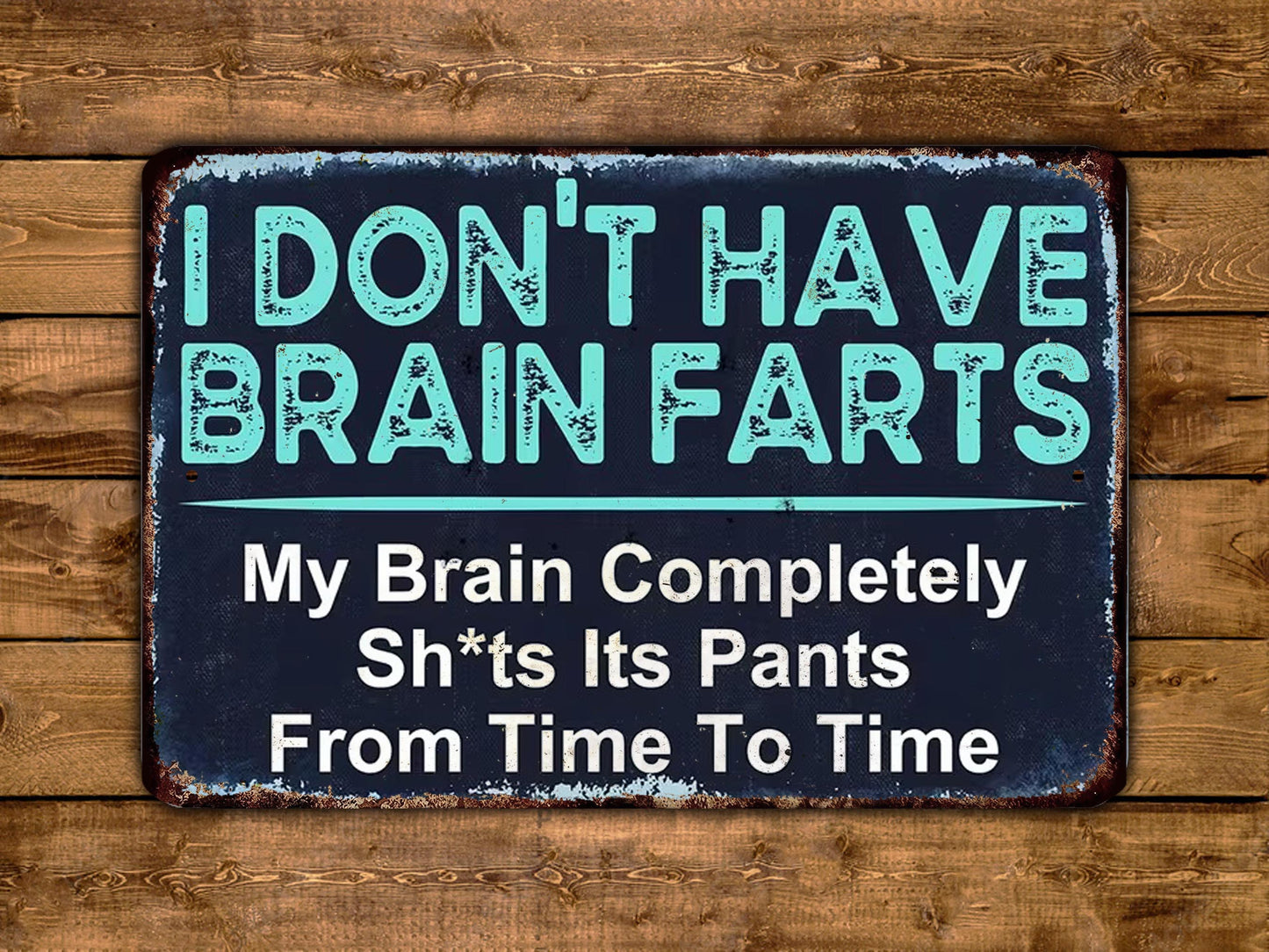 a humorous sign with the text "I DON'T HAVE BRAIN FARS" and "My Brain Completely Sh*t's Its Pants From Time To Time" against a wooden background.
