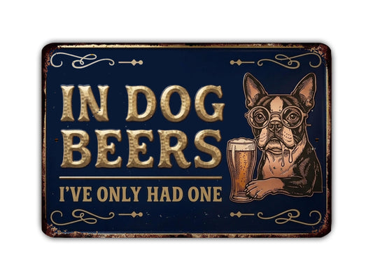 A sign with the text "IN DOG BEERS I'VE ONLY HAD ONE" and an illustration of a dog holding a glass of beer.