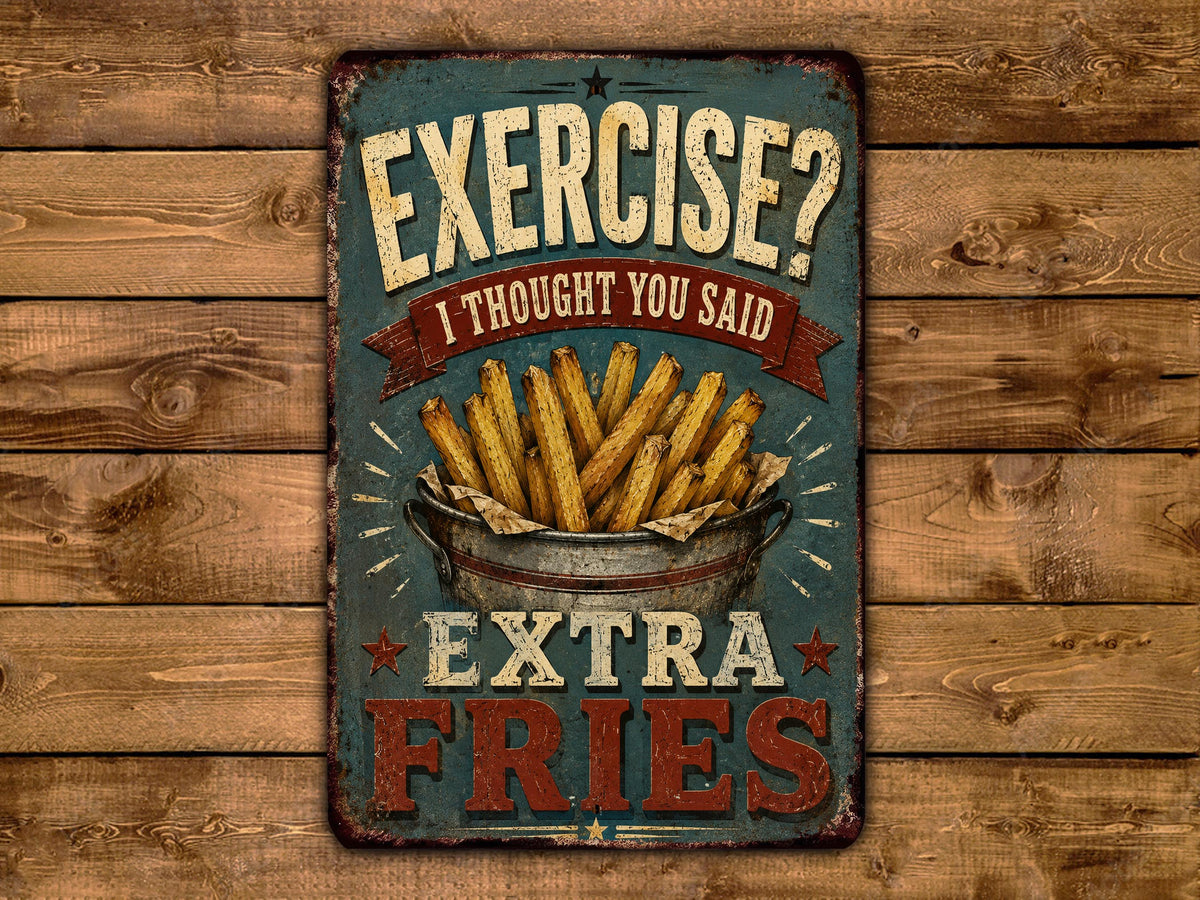 a vintage-style sign with the text "EXERCISE? I Thought You Said EXTRA FRIES" and an illustration of a bucket filled with french fries.