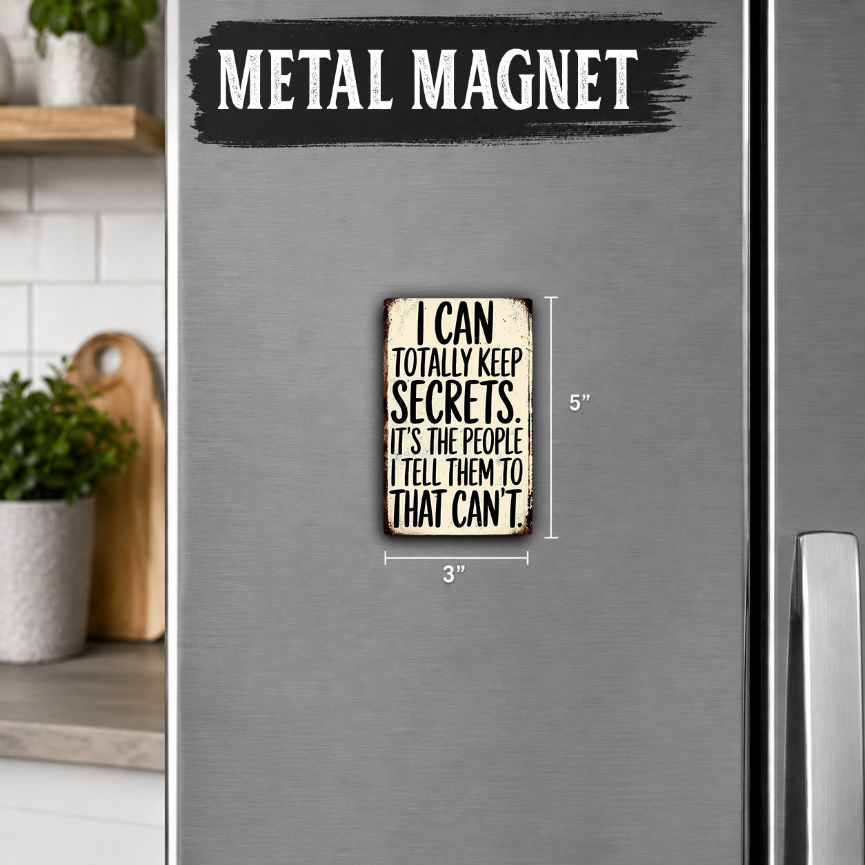 a small metal magnet with a humorous message on it, placed on a refrigerator.