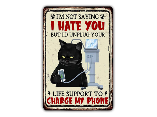 a metal sign with a black cat holding a cell phone