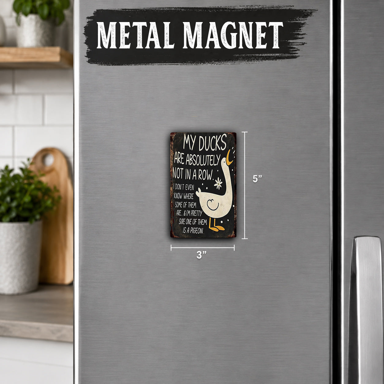 a small black and white metal magnet with a humorous message about ducks.