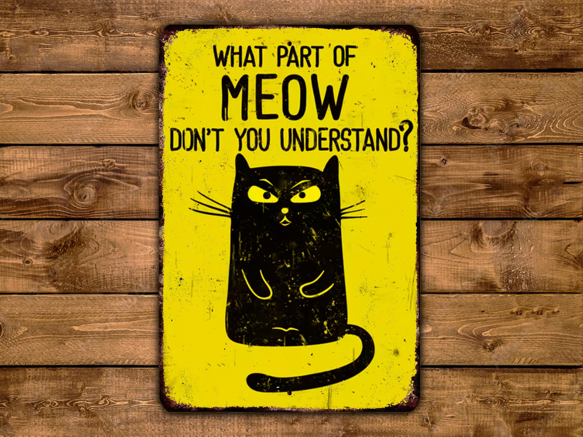 A yellow sign with a black cat illustration and text on it.