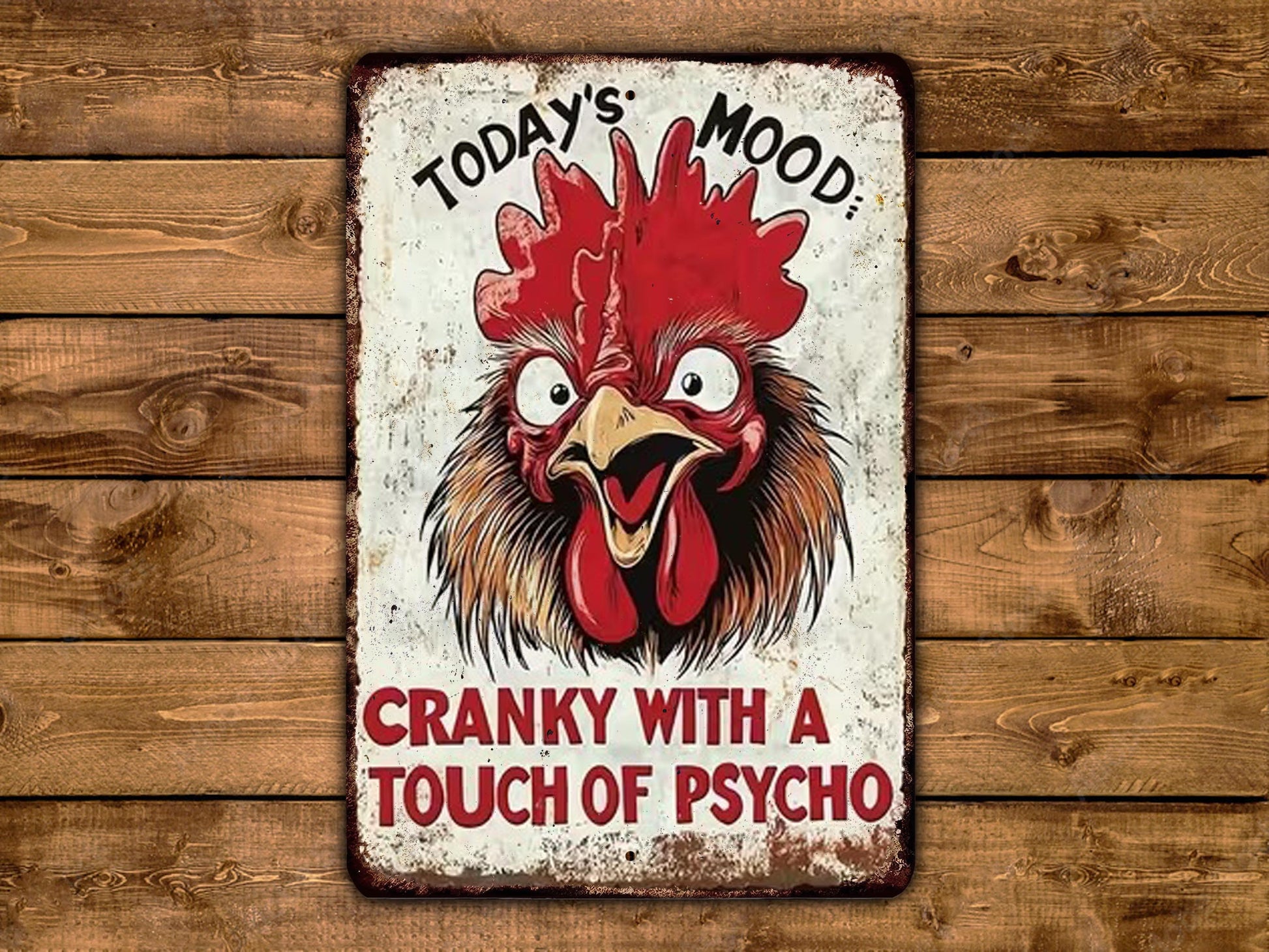 A metal sign with a rooster's head and the text "Today's mood: CRANKY WITH A TOUCH OF PSYCHO"